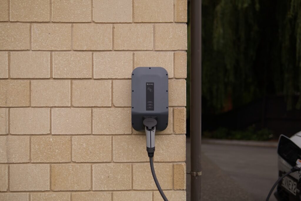 Electric vehicle charger connected to a wall outlet